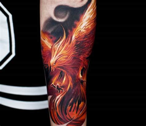 Colored Realistic Phoenix Tattoo On Forearm By Jurgis