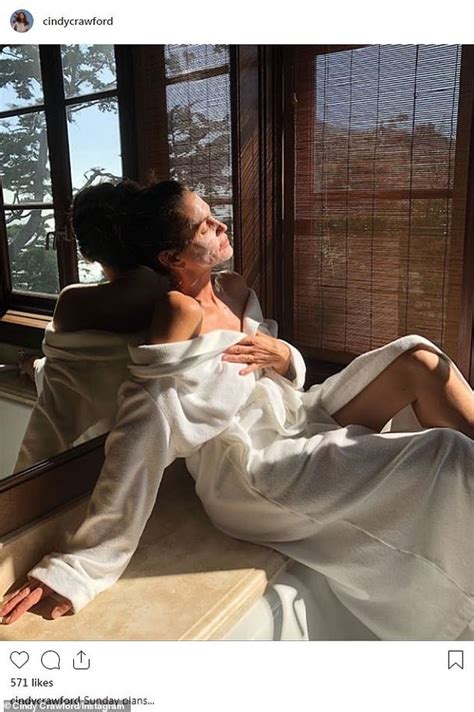 Cindy Crawford Lets Her White Robe Fall Off Her Shoulders At Her Malibu