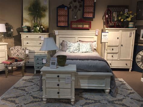 Shop a wide variety of collections and styles to create your dream sanctuary, and it all comes create a place to escape from the world with our large selection of bedroom furniture. White Marsilona Queen Panel Bed in store display | Bedroom ...