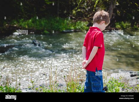 Little Boy With Hands Behind Back Stock Photos And Little Boy With Hands