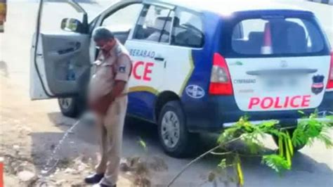 Hyderabad Cop Caught Peeing In Public Pic Goes Viral Oneindia News Youtube