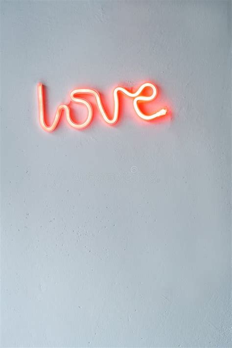 Red Neon Love Sign On A White Wall Stock Photo Image Of Letter