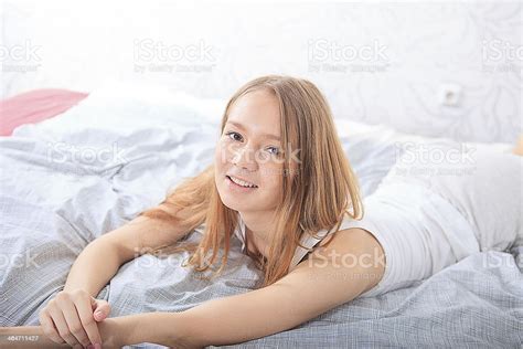 Girl Lying On Her Stomach And Sexy Looks Stock Photo Hot Sex Picture