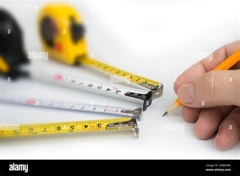 Measure Tapes On A White Background Inches And Centimeters Stock Photo