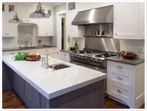 A kitchen bar with sink has patterned quartz countertop in white color shade. Torquay Cambria Quartz - Denver Shower Doors & Denver Granite Countertops