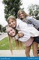 Group of Teenage Girls Playing and Smiling Together Outdoors Stock ...