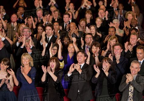 Clapping theater audience - Stock Photo - Dissolve