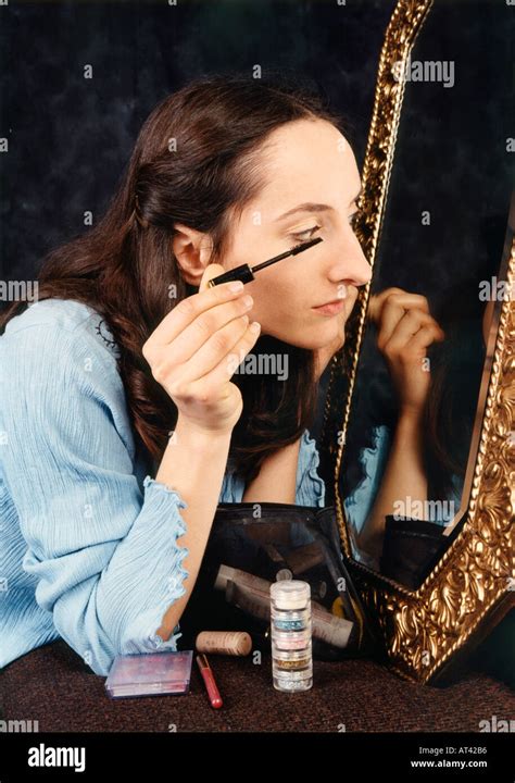 Girl Applying Makeup Stock Photo Alamy