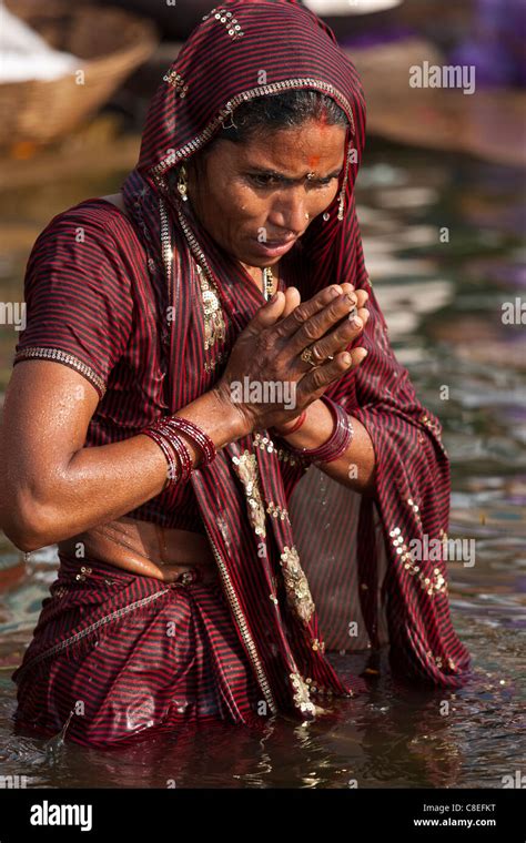 indian hindu pilgrims bathing in the ganges river at dashashwamedh ghat in holy city of varanasi