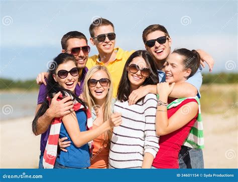 Group Of Friends Having Fun On The Beach Stock Photo Image Of Lovely