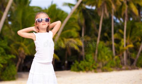 Adorable Little Girl On Tropical Beach Vacation In Stock Photo Image