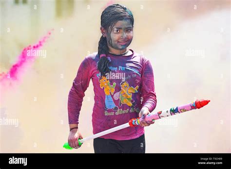 Girl Playing With Pichkari Holi Festival Stock Photo Alamy