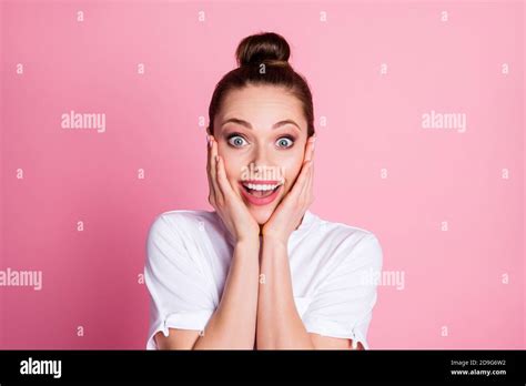 Portrait Of Astonished Positive Girl Hear Wonderful Novelty Touch Face