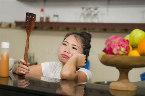 Young Frustrated Asian Woman In Domestic Chores Stress Lifestyle Home