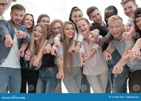 Group Of Young People Together Pointing At Something Stock Photo
