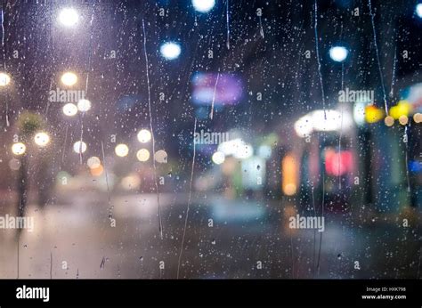 City Street Lights Through Window Glass With Rain Drops Stock Photo Alamy
