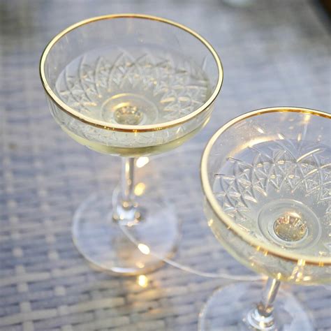 Pair Of Gold Rimmed Vintage Style Champagne Glasses By Dress For Dinner Tablescapes