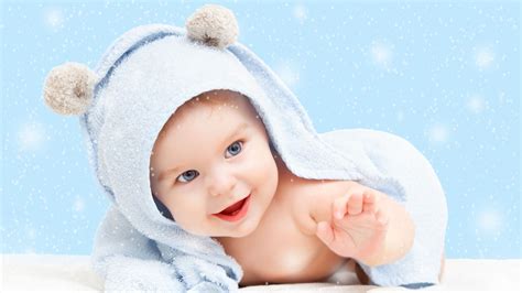 Cute Baby Is Lying Down On White Towel With Sparkling Background