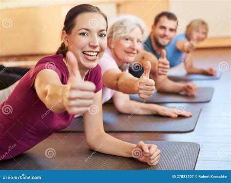 Group Holding Thumbs Up In Gym Stock Image Image Of Fitness