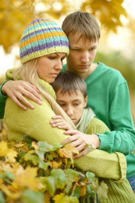 Sad Mother With Her Sons Stock Photo By ©aletia 87651972