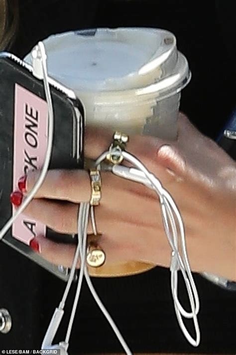 Ashley Benson Sports Gold Band On Ring Finger While Grabbing Coffee In