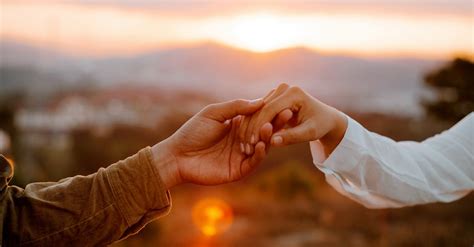 Unrecognizable Couple Holding Hands At Sunset · Free Stock Photo