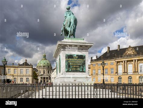 Tourists Visit The Amalienborg Palace Square Sculpture Of Frederik V