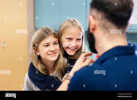 Smiling Girls Talking With Teacher Stock Photo Alamy