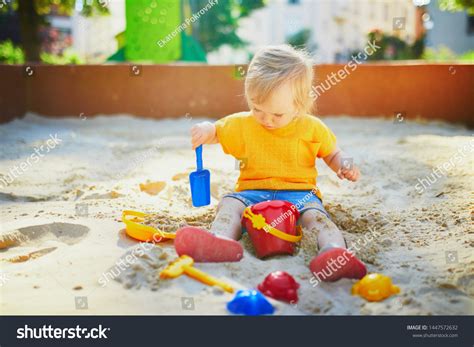 Adorable Little Girl On Playground Sandpit Stock Photo 1447572632