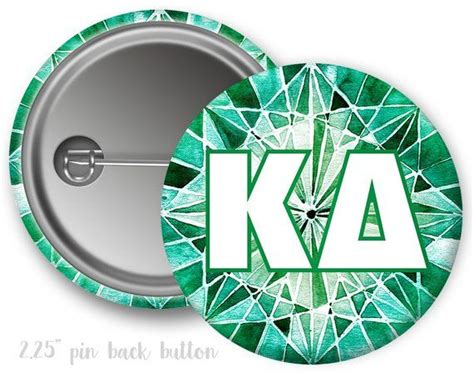 A Button With The Letter K A On It And An Image Of A Diamond Pattern