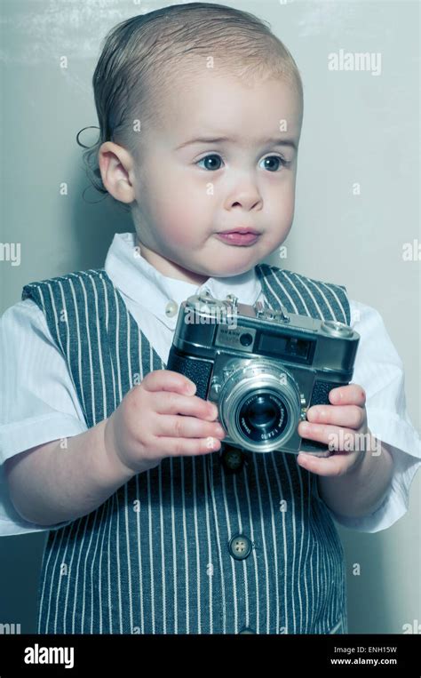 Old Fashioned Style Portrait Of Cute Caucasian Toddler In A Waistcoat