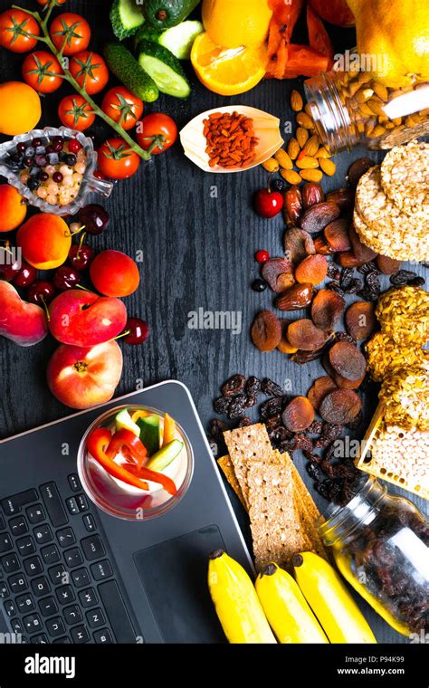 Healthy Snack Food On Wooden Table With Notebook Copy Space Top View