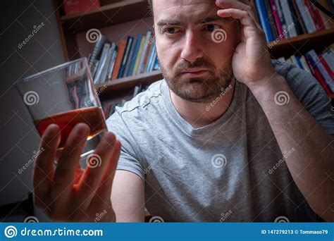 Alcohol Addicted Man Portrait Alone With Spirit Bottle Obraz Stock