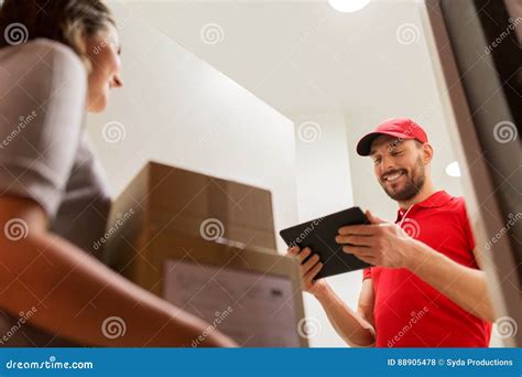 Deliveryman With Tablet Pc And Customer With Boxes Stock Photo Image