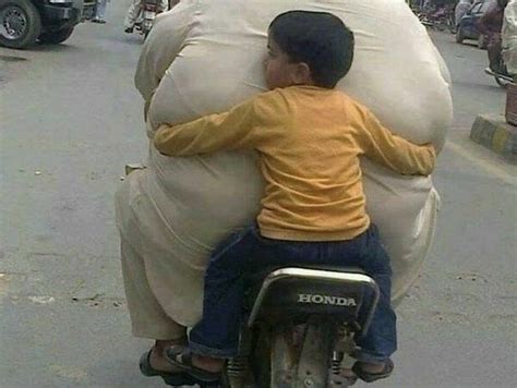 Found this old pic of my fat boy when he was so tiny. Little Kid With Fat Man On Bike Funny Picture