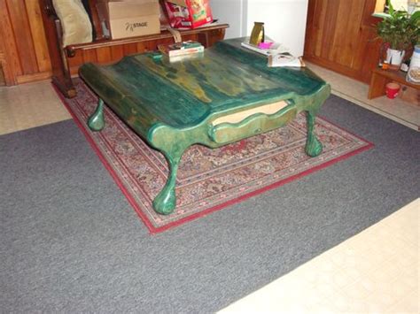 Even though the two may occupy exactly the same footprint, the wood table will have a bigger presence in the room and seem to take up more floor space. Hand Crafted Green Coffee Table by Te Studio | CustomMade.com