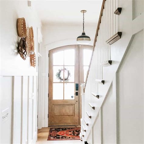 White And Wood Entryway With Staircase Soul And Lane