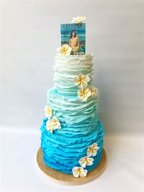 Ombré ruffle beach themed cake with frangipani sugar flowers | Beach themed cakes, Themed cakes ...