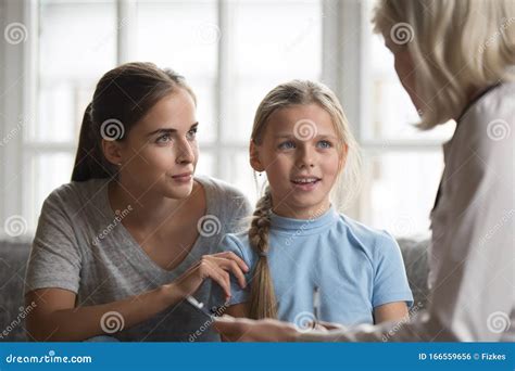 Mother And Daughter Visit Pediatrician In Hospital Royalty Free Stock