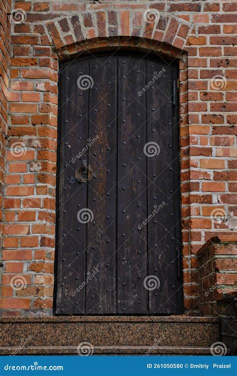 Old Gothic Wooden Door In Brick Building Stock Photo Image Of