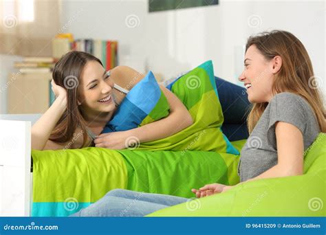 Two Teen Friends Talking In A Bedroom Stock Image Image Of Home Adults
