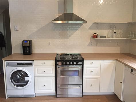 This kitchen cabinet squeezes in a washing machine that makes the perfect place for a utility zone. Got Hygge? 3 IKEA Kitchens Designed for the Winter