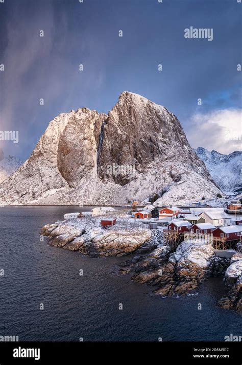 Red Norwegian Rorbuer Huts And Festhaeltinden Mountain In Winter
