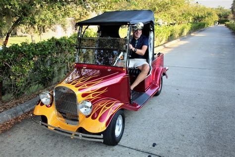 the golf cart is king at the villages but the grass isn t all green hagerty media