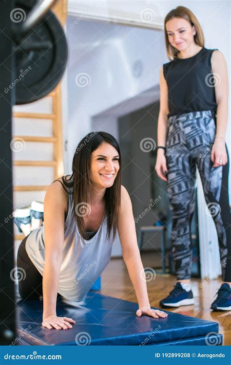 Two Young Women Exercising At The Gym Stock Photo Image Of Plank