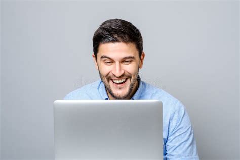 Happy Man With Laptop Computer Isolated On Gray Stock Photo Image Of
