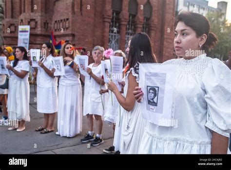protesters are seen with photos of victims of the colombian army