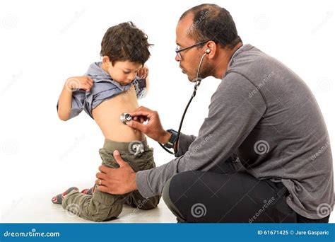 Doctor Is Checking A Boy With A Stethoscope Stock Image Image Of