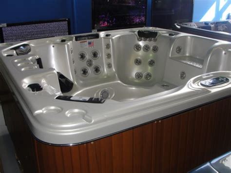 Cal Spas Escape Select Series Hot Tub With Ivory Interior And Teak Cabinet Features Inc