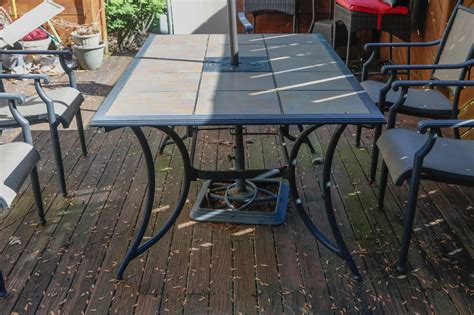 Ceramic Tile Top Patio Dining Table And Chairs With Umbrella Ebth